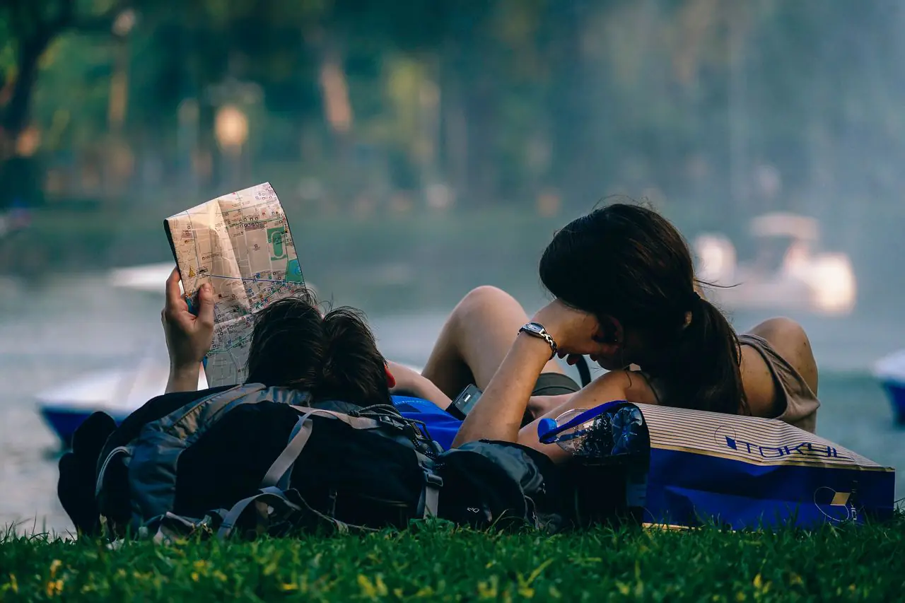 Two travelers sharing a quiet moment in a park in Bangkok